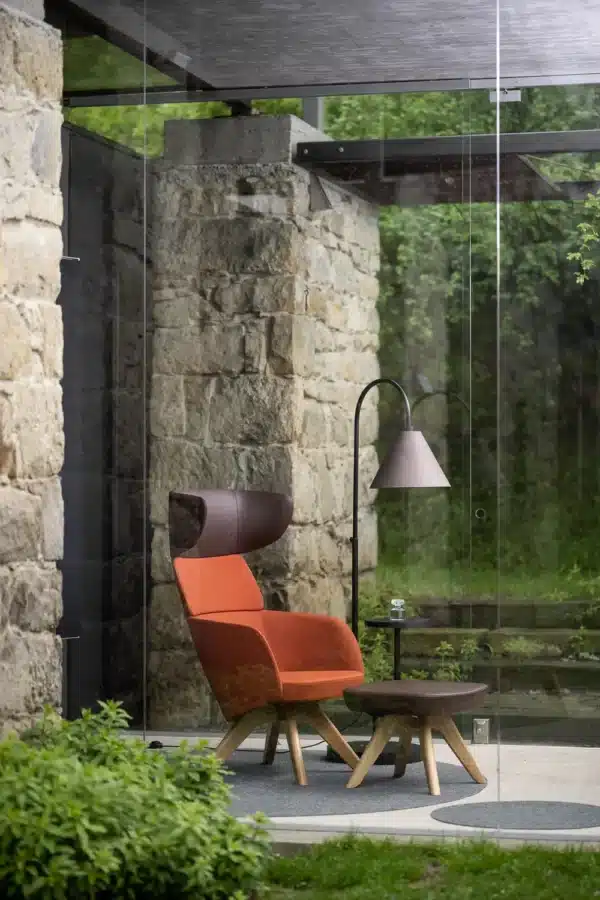 WINX lounge armchair with high backrest for privacy and comfort