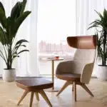WINX lounge armchair with elegant upholstered shell and metal base