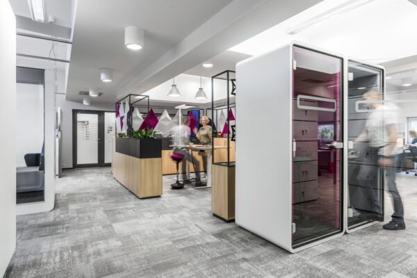 Hushphone Single office telephone booth with ergonomic armrest and glass paneling