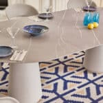 Round office table with plates and decor in workspace Malta