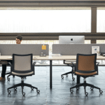 VITAL Plus office desk with integrated power access and collaborative workstation design