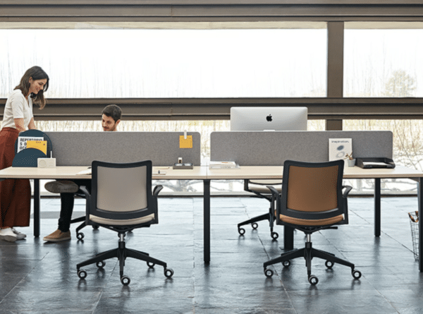 VITAL Plus office desk with integrated power access and collaborative workstation design